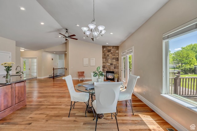 67 E Summer Pl S, Saratoga Springs, UT 84045 - dining room with vaulted ceiling, baseboards, light wood finished floors, a ceiling fan, and a chandelier