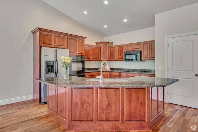 67 E Summer Pl S, Saratoga Springs, UT 84045 - kitchen featuring a sink, black appliances, dark stone counters, light wood finished floors, and high vaulted ceiling