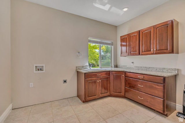 67 E Summer Pl S, Saratoga Springs, UT 84045 - kitchen with a sink, brown cabinetry, and light tile patterned floors
