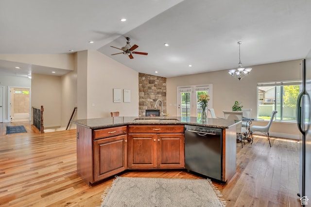 67 E Summer Pl S, Saratoga Springs, UT 84045 - kitchen featuring dishwashing machine, a sink, light wood-style floors, an island with sink, and lofted ceiling