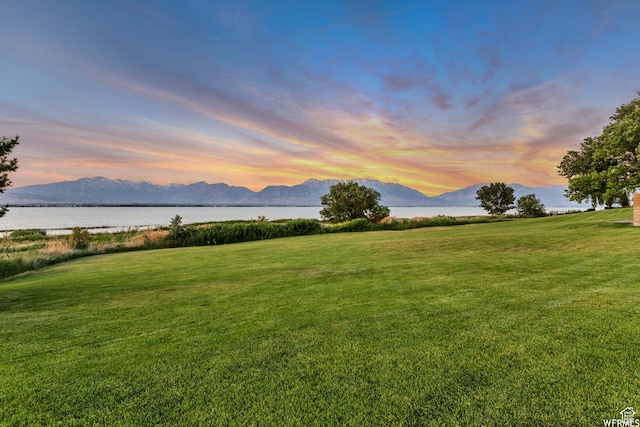 67 E Summer Pl S, Saratoga Springs, UT 84045 - yard at dusk with a yard and a water and mountain view