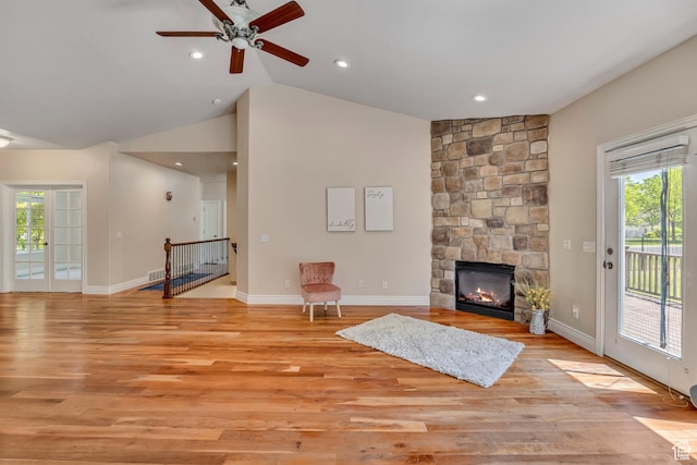 67 E Summer Pl S, Saratoga Springs, UT 84045 - living area featuring plenty of natural light, light wood-style flooring, a ceiling fan, vaulted ceiling, and a fireplace