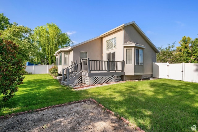 3601 S Truth Ln, Magna, UT 84044 - rear view of property with a wooden deck, a gate, and stucco siding