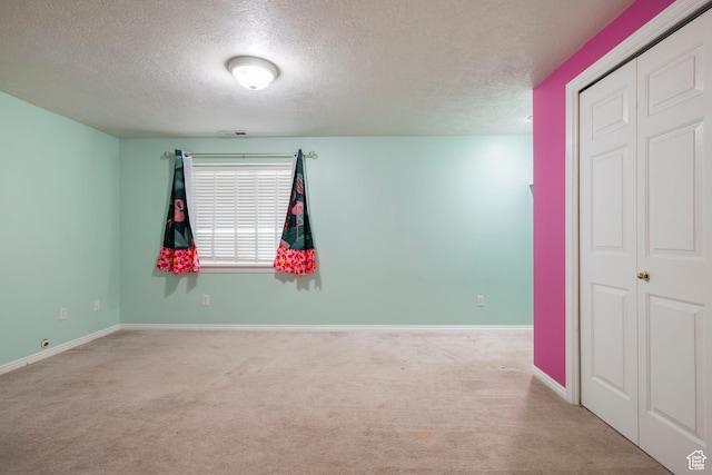 3601 S Truth Ln, Magna, UT 84044 - spare room with a textured ceiling, carpet floors, and baseboards
