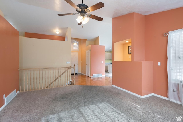 3601 S Truth Ln, Magna, UT 84044 - carpeted empty room featuring ceiling fan, baseboards, and vaulted ceiling