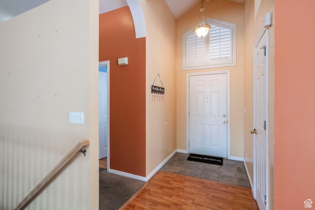 3601 S Truth Ln, Magna, UT 84044 - entrance foyer featuring arched walkways, wood finished floors, and baseboards
