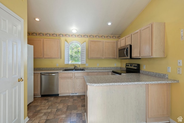 3601 S Truth Ln, Magna, UT 84044 - kitchen with appliances with stainless steel finishes, light brown cabinetry, a sink, a peninsula, and dark stone finish floors
