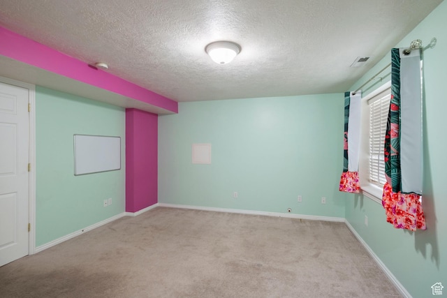 3601 S Truth Ln, Magna, UT 84044 - empty room featuring a textured ceiling, carpet flooring, baseboards, and a smoke detector