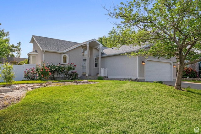 3601 S Truth Ln, Magna, UT 84044 - view of front of house with stucco siding, a garage, driveway, and roof with shingles