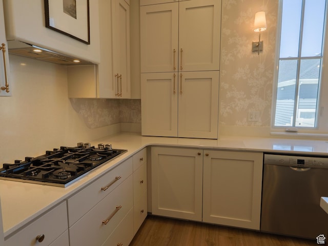 4817 W 50 S, West Point, UT 84015 - kitchen with dishwasher, black gas stovetop, light countertops, wallpapered walls, and white cabinetry