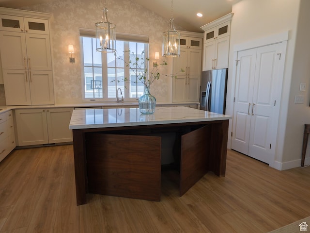 4817 W 50 S, West Point, UT 84015 - kitchen featuring stainless steel refrigerator with ice dispenser, wood finished floors, a chandelier, lofted ceiling, and a kitchen island