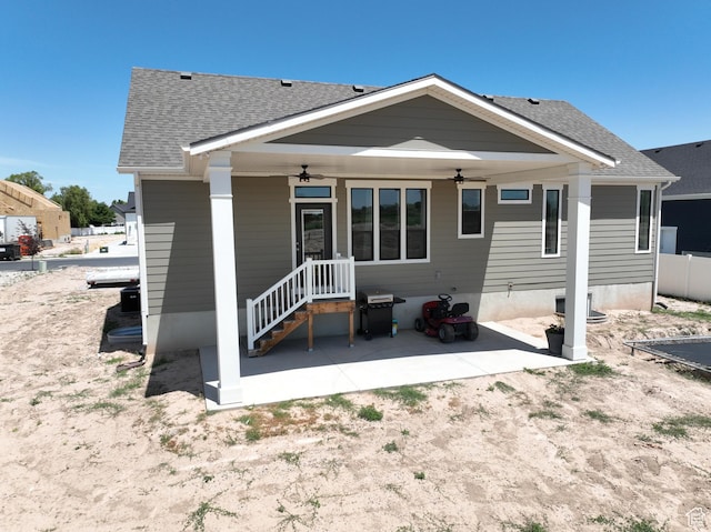 4817 W 50 S, West Point, UT 84015 - rear view of property featuring a ceiling fan, a shingled roof, and a patio area