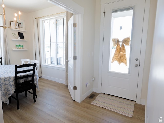 4817 W 50 S, West Point, UT 84015 - entryway with a chandelier, baseboards, and light wood-style flooring