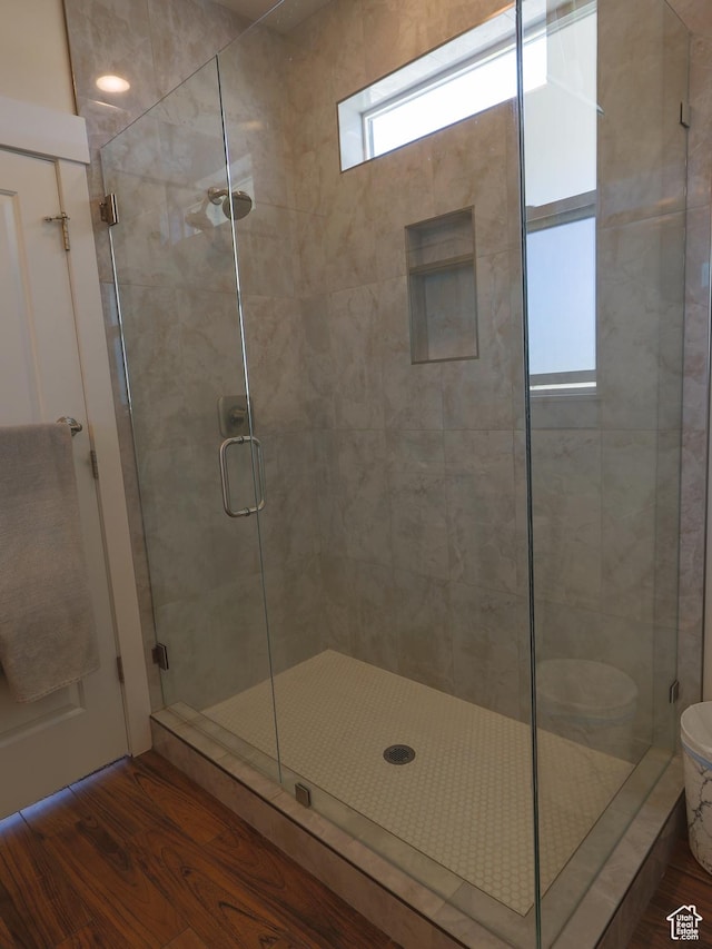 4817 W 50 S, West Point, UT 84015 - full bathroom featuring a stall shower and wood finished floors