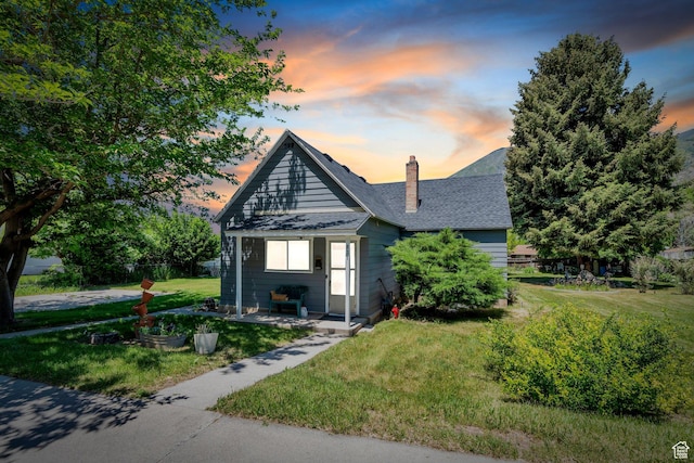 831 E Hillcrest Dr, Springville, UT 84663 - bungalow with a lawn, a chimney, and roof with shingles