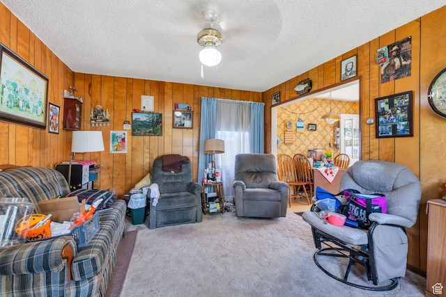 831 E Hillcrest Dr, Springville, UT 84663 - carpeted living area featuring healthy amount of natural light, a textured ceiling, ceiling fan, and wooden walls