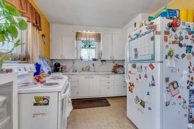 831 E Hillcrest Dr, Springville, UT 84663 - kitchen featuring freestanding refrigerator, stove, a sink, light countertops, and white cabinetry