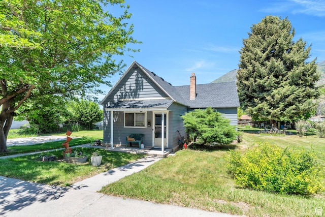 831 E Hillcrest Dr, Springville, UT 84663 - bungalow-style home with a chimney, roof with shingles, and covered porch