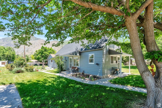 831 E Hillcrest Dr, Springville, UT 84663 - view of property exterior with a mountain view, a lawn, and a patio area