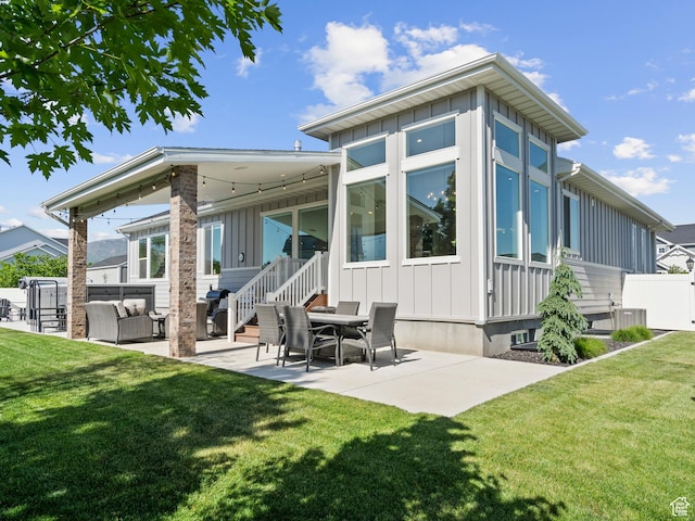 2393 N 300 E Unit 108, Lehi, UT 84043 - back of house featuring board and batten siding, a patio area, and an outdoor living space