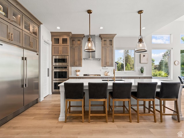 2393 N 300 E Unit 108, Lehi, UT 84043 - kitchen with built in appliances, a sink, light countertops, tasteful backsplash, and recessed lighting