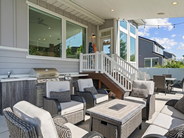 2393 N 300 E Unit 108, Lehi, UT 84043 - view of patio featuring area for grilling, outdoor dining space, a sink, and an outdoor living space with a fire pit