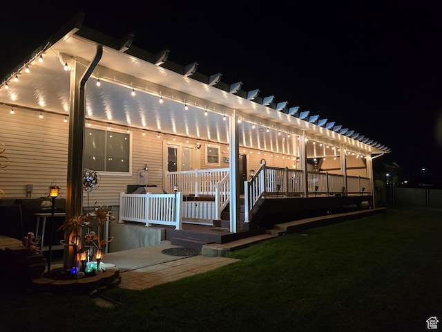 9162 S Pebble Glen Cir, Sandy, UT 84094 - back of house at night featuring a pergola