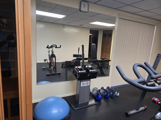 9162 S Pebble Glen Cir, Sandy, UT 84094 - workout area featuring a drop ceiling and baseboards