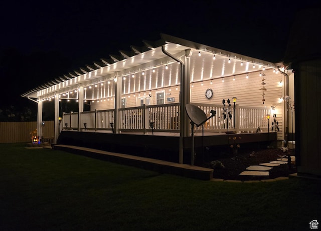 9162 S Pebble Glen Cir, Sandy, UT 84094 - back of house at night featuring a pergola and a wooden deck
