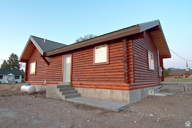 75 N 4th E, Downey, ID 83234 - log home featuring entry steps, log exterior, and metal roof