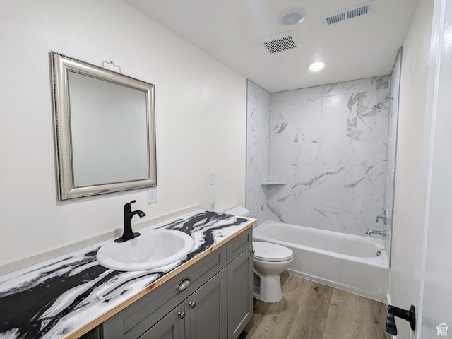 75 N 4th E, Downey, ID 83234 - full bathroom featuring vanity, wood finished floors, toilet, tub / shower combination, and recessed lighting