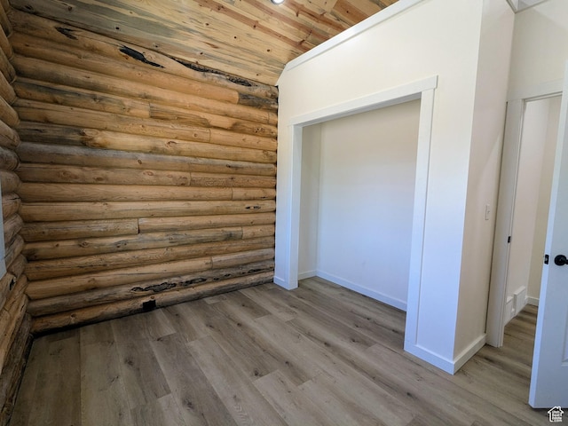 75 N 4th E, Downey, ID 83234 - unfurnished bedroom featuring rustic walls, wood finished floors, baseboards, and wooden ceiling