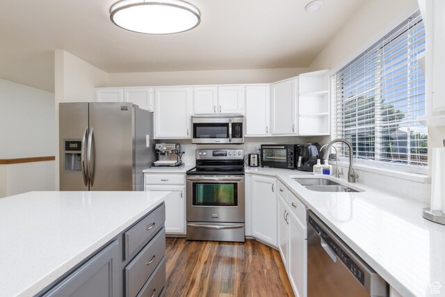 1199 E Pheasant View Dr, Layton, UT 84041 - kitchen featuring stainless steel appliances, a sink, light countertops, and white cabinetry