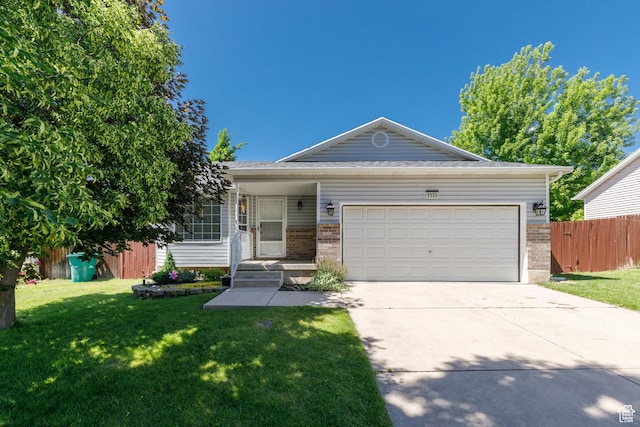 1199 E Pheasant View Dr, Layton, UT 84041 - view of front of house featuring driveway, a garage, and brick siding
