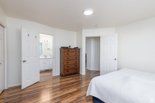 1199 E Pheasant View Dr, Layton, UT 84041 - bedroom with dark wood-style flooring, baseboards, and ensuite bath