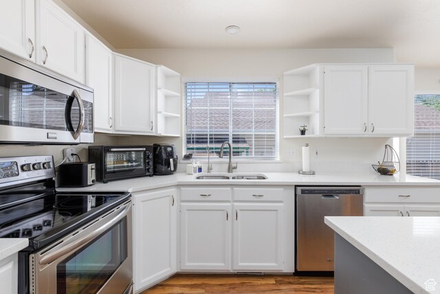 1199 E Pheasant View Dr, Layton, UT 84041 - kitchen with open shelves, stainless steel appliances, a sink, and healthy amount of natural light