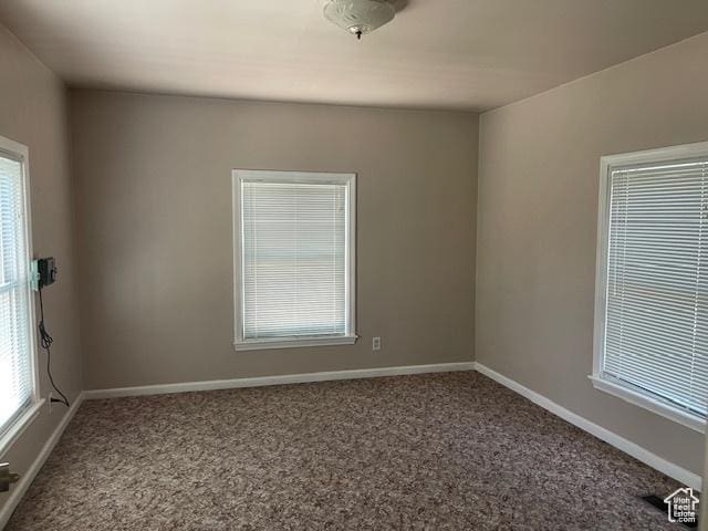 2646 S 1700 E, Salt Lake City, UT 84106 - empty room featuring carpet, healthy amount of natural light, and baseboards