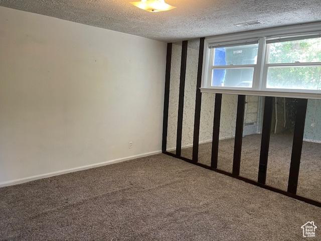 2646 S 1700 E, Salt Lake City, UT 84106 - carpeted empty room with a textured ceiling and baseboards