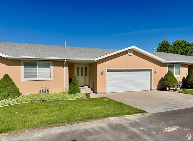 445 Topaz Blvd Unit 10, Delta, UT 84624 - single story home featuring an attached garage, a front lawn, stucco siding, and driveway