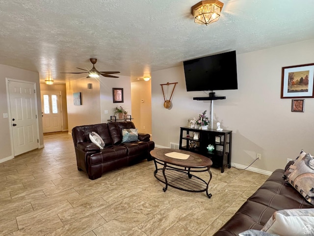 445 Topaz Blvd Unit 10, Delta, UT 84624 - living area with ceiling fan, baseboards, and a textured ceiling