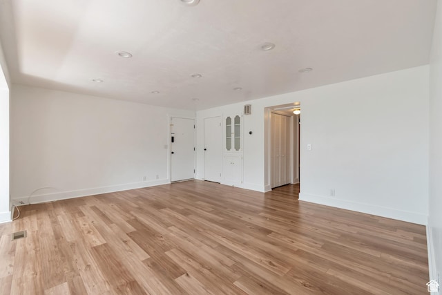 265 N Vine St W Unit 1, Salt Lake City, UT 84103 - empty room with light wood finished floors, baseboards, and recessed lighting