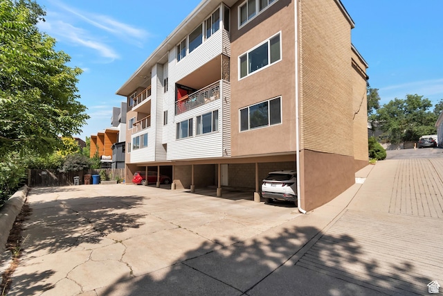265 N Vine St W Unit 1, Salt Lake City, UT 84103 - view of property featuring covered parking