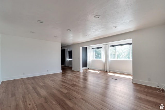 265 N Vine St W Unit 1, Salt Lake City, UT 84103 - empty room with wood finished floors and baseboards