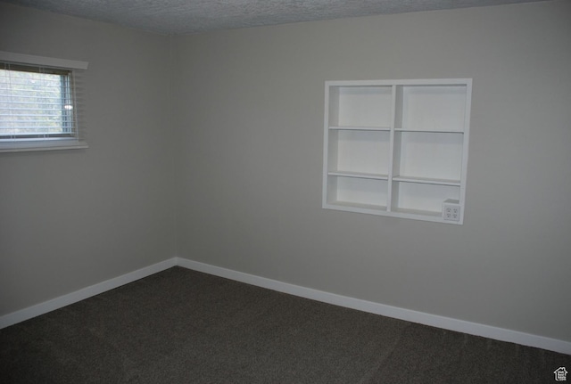 1530 N 2000 W, Farr West, UT 84404 - spare room featuring a textured ceiling, dark carpet, and baseboards
