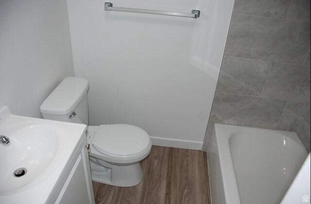 1530 N 2000 W, Farr West, UT 84404 - full bath with wood finished floors, a bath, toilet, and vanity