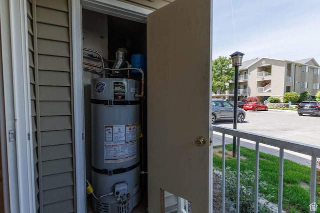 3760 S Carlisle Park Pl Unit 1, Salt Lake City, UT 84119 - detailed view of secured water heater and parking