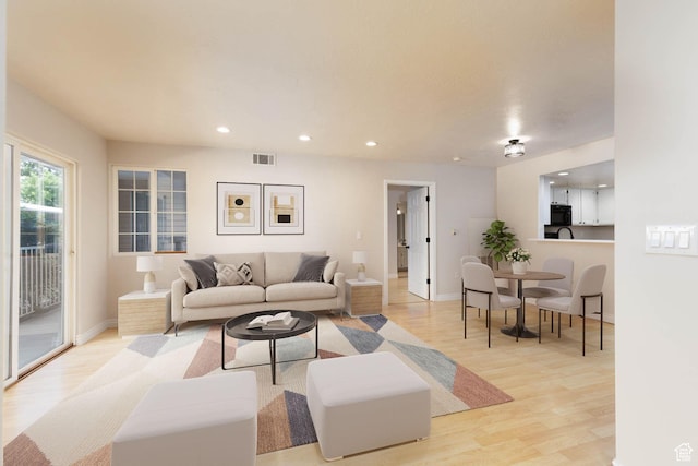 3760 S Carlisle Park Pl Unit 1, Salt Lake City, UT 84119 - living room with light wood finished floors, recessed lighting, and baseboards