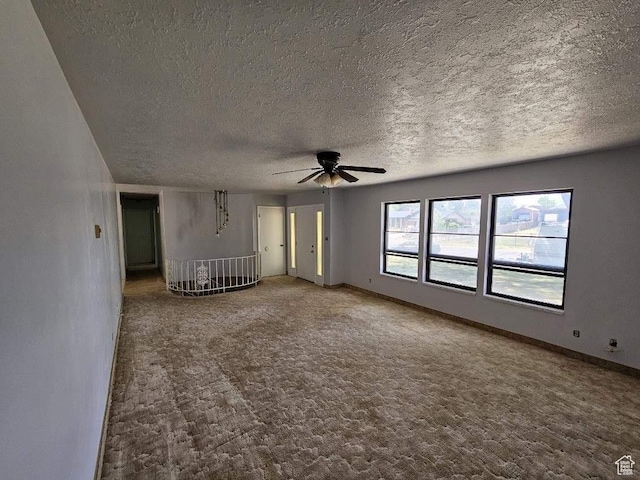 160 E 300 S, Gunnison, UT 84634 - unfurnished living room featuring a ceiling fan, a textured ceiling, and carpet floors