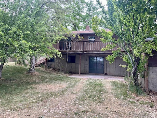 160 E 300 S, Gunnison, UT 84634 - rear view of house with a deck, a chimney, stairs, and a patio area