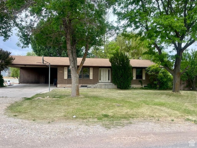 160 E 300 S, Gunnison, UT 84634 - single story home with a carport, driveway, and a front yard